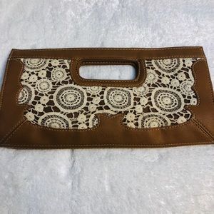 Women’s brown and cream clutch bag